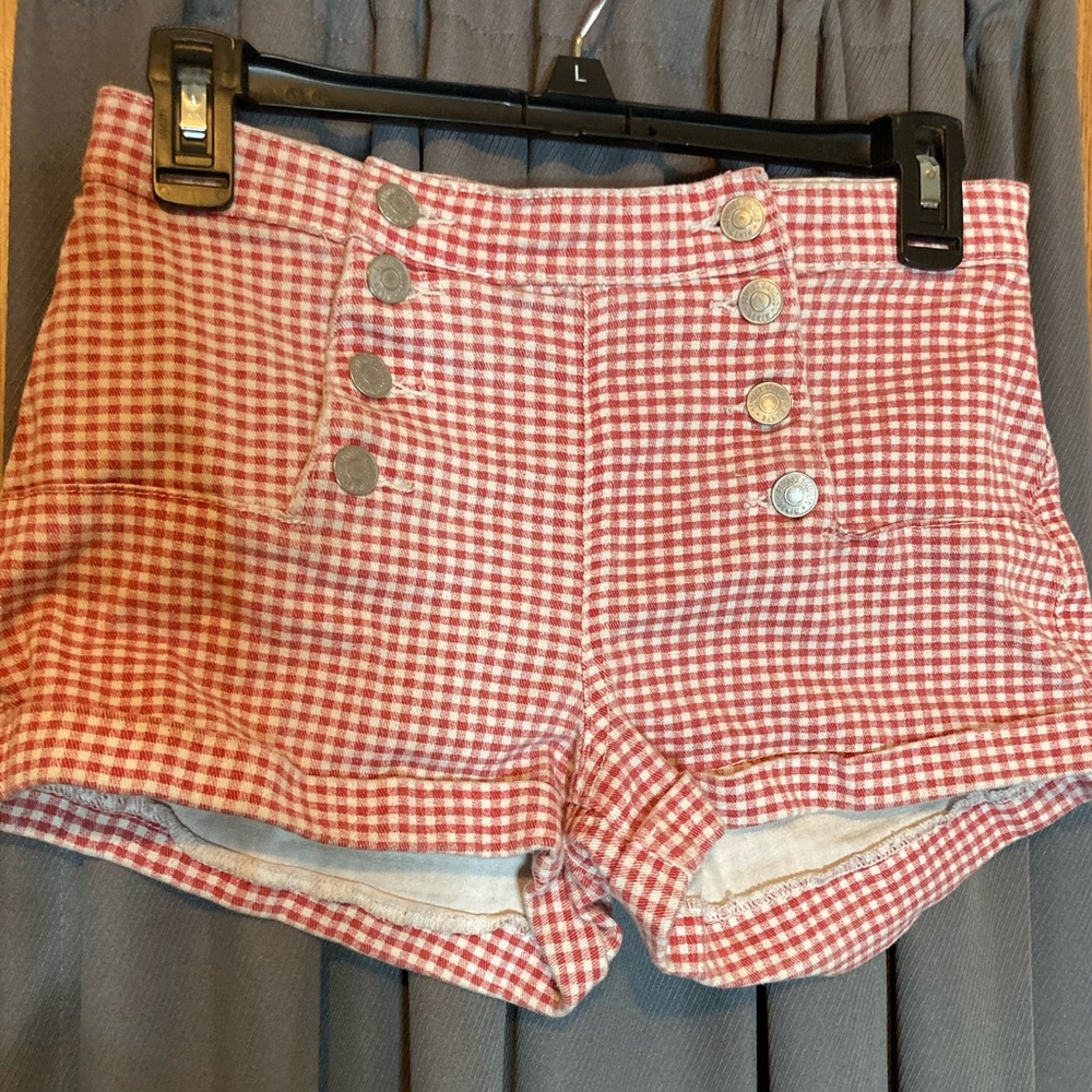 Red and white checkered shorts, high waisted.